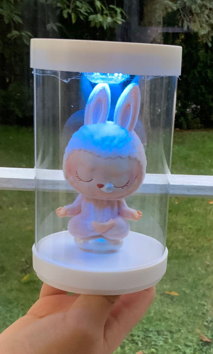 Doll capsule with light.