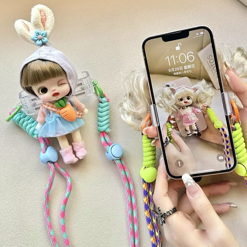 Halsstrop / reim for mobil med dukke.